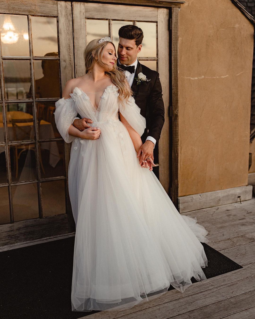 A-line silhouette wedding dress Melissa with the split on the skirt and off-shoulder sleeves by Rara Avis at Dell'Amore Bridal, Auckland. 6