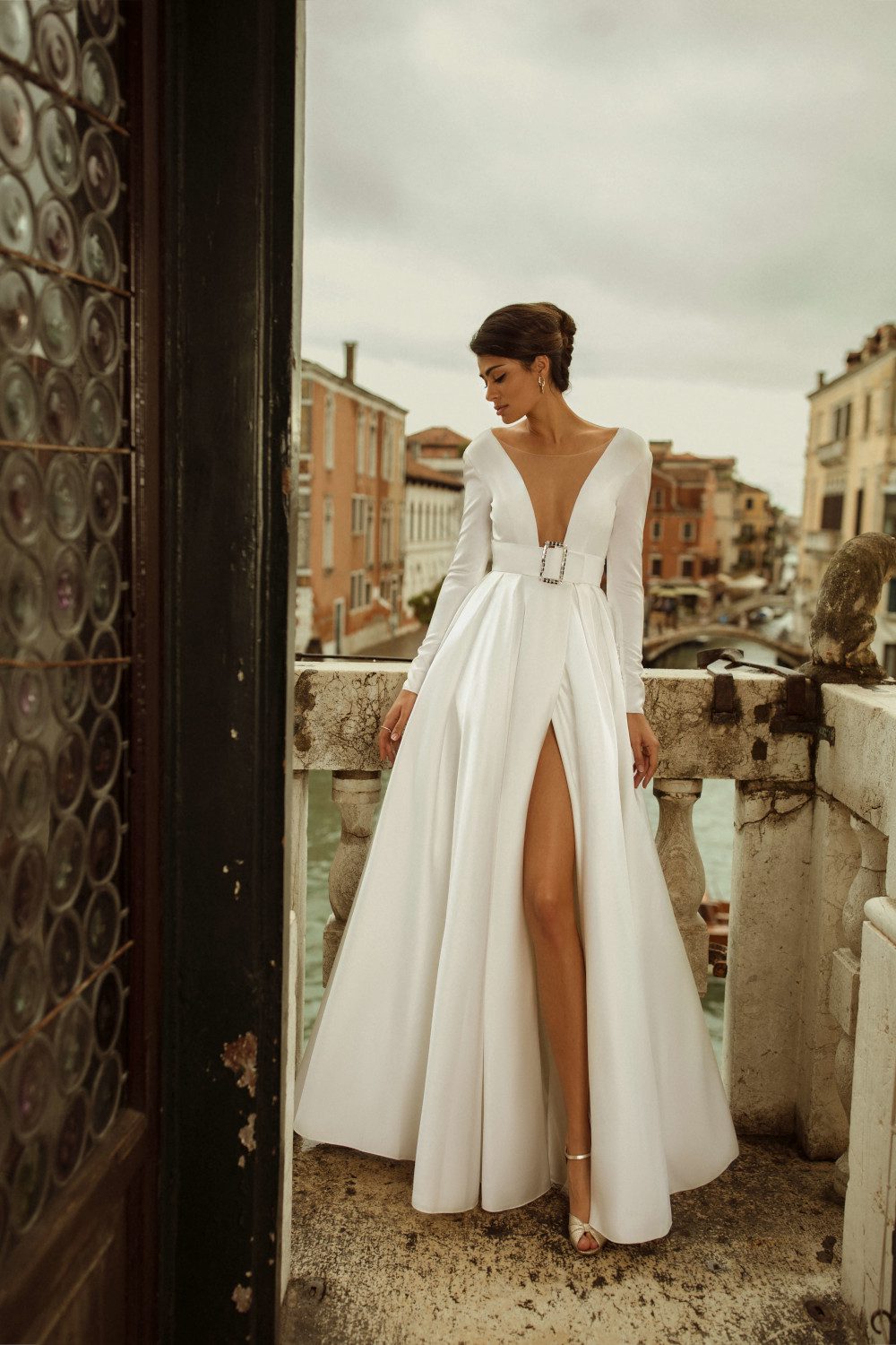 Classic wedding dress Charlen with a V-neckline and a belt at the waist by Rara Avis at Dell' Amore Bridal, Auckland, NZ. 3