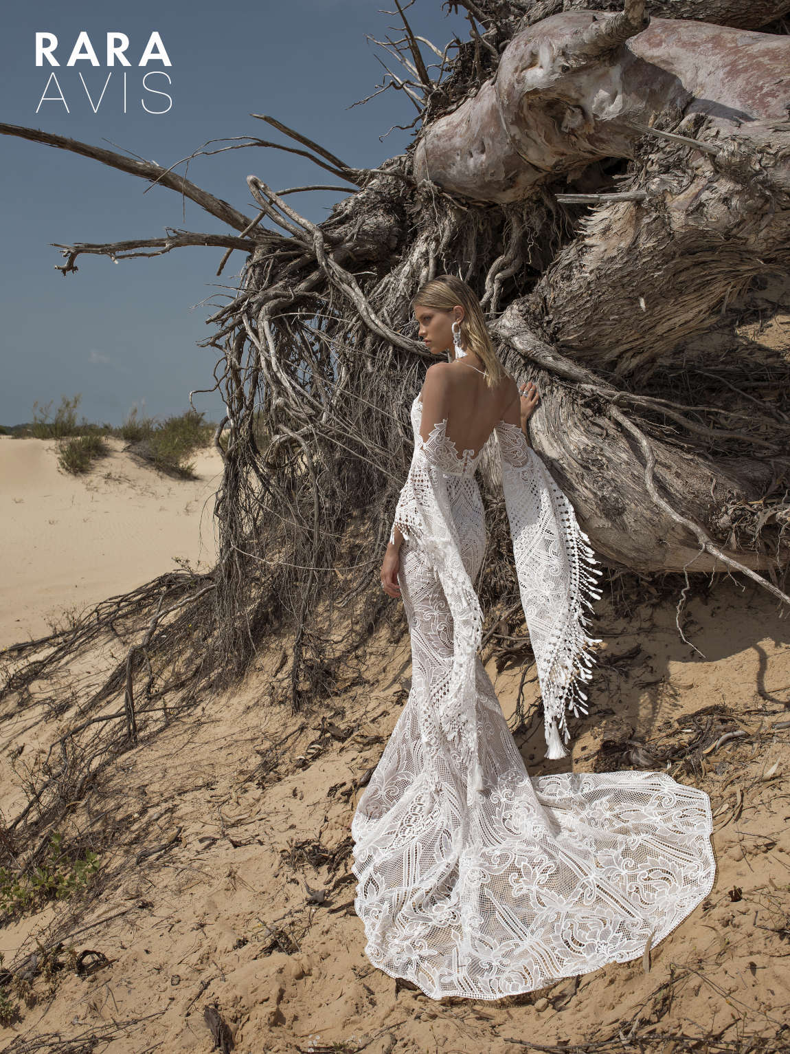 sexy boho wedding dress Lari by Rara Avis with mermaid silhouette, statement long sleeves and deep sweetheart neckline. 1