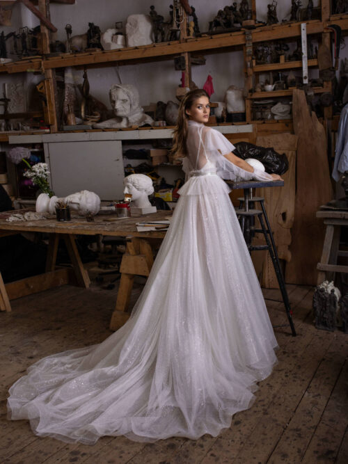 Romantic modest wedding dress Letrin with Long Sleeves available from Dell'Amore Bridal. 1