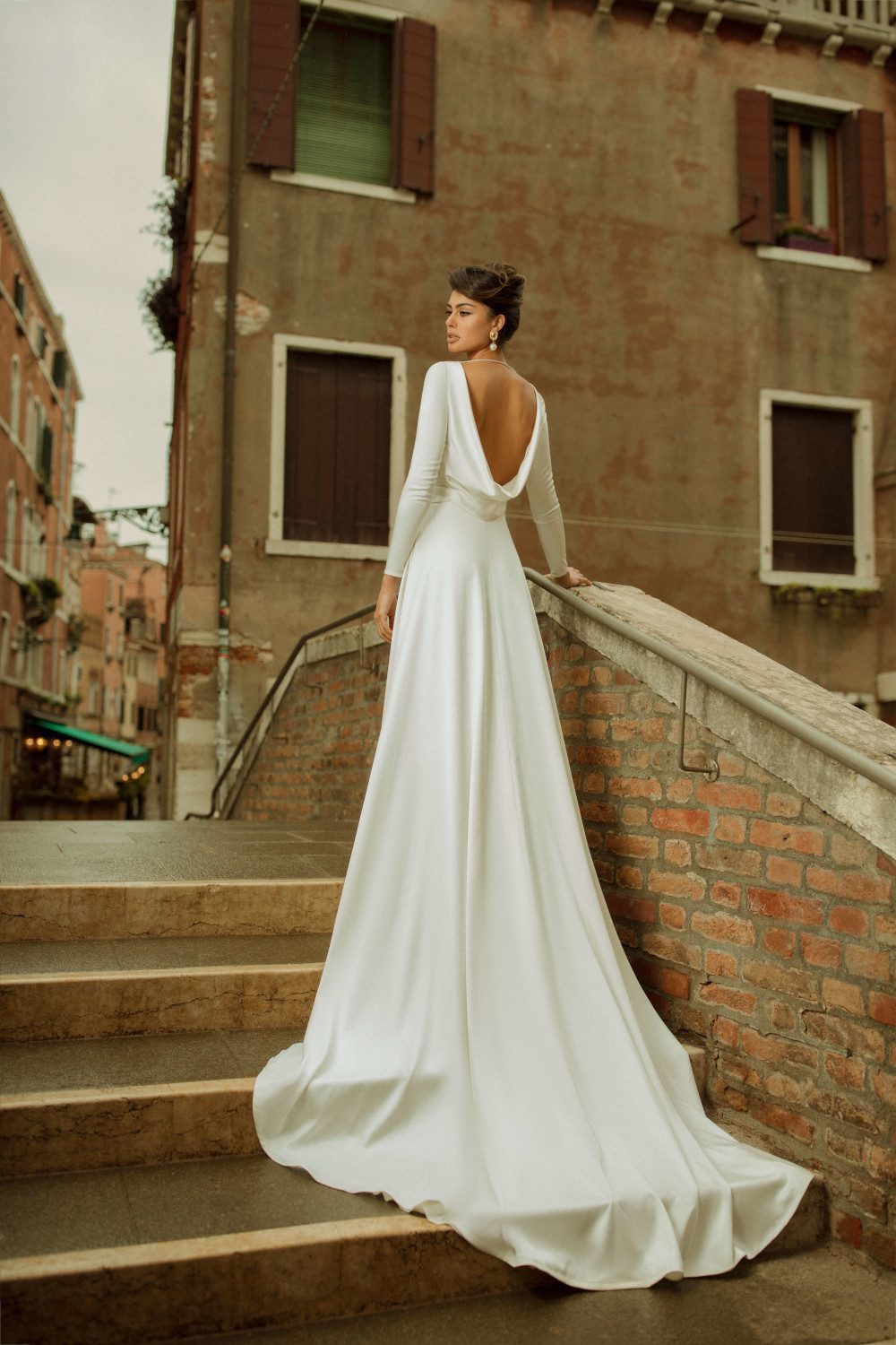 A - silhouette wedding dress with a white belt decorated pearls at the waist by Rara Avis at Dell'Amore Bridal, Auckland, NZ. 1