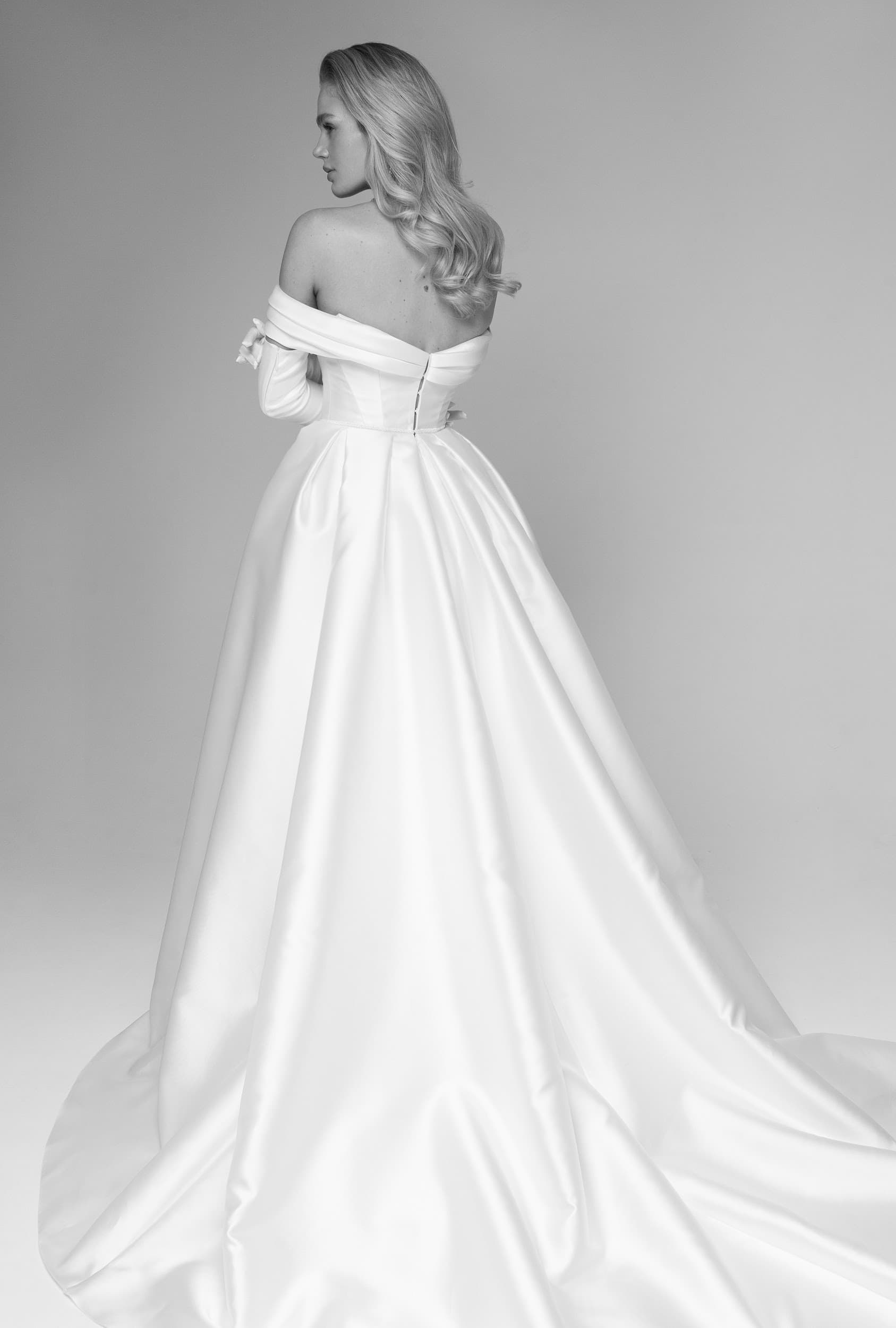 Rara Avis satin off-shoulder wedding dress Rhine at Dell'Amore Bridal, NZ. 5