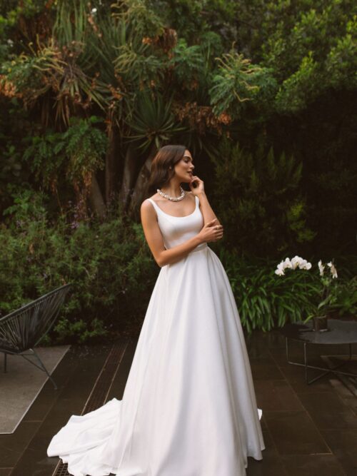 Rara Avis simple satin wedding dress Vela with a long train at Dell'Amore Bridal, NZ 4