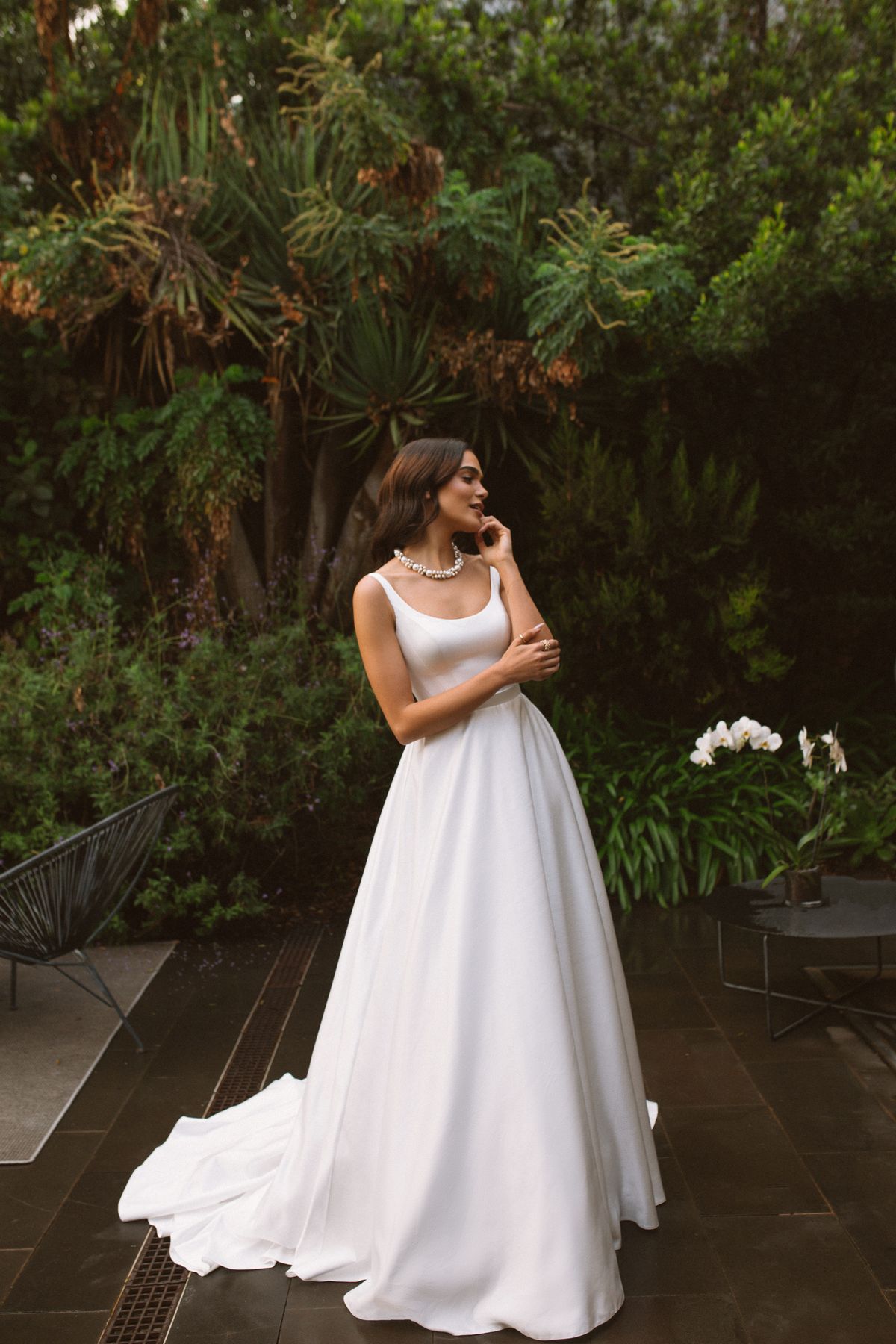 Rara Avis simple satin wedding dress Vela with a long train at Dell'Amore Bridal, NZ 4