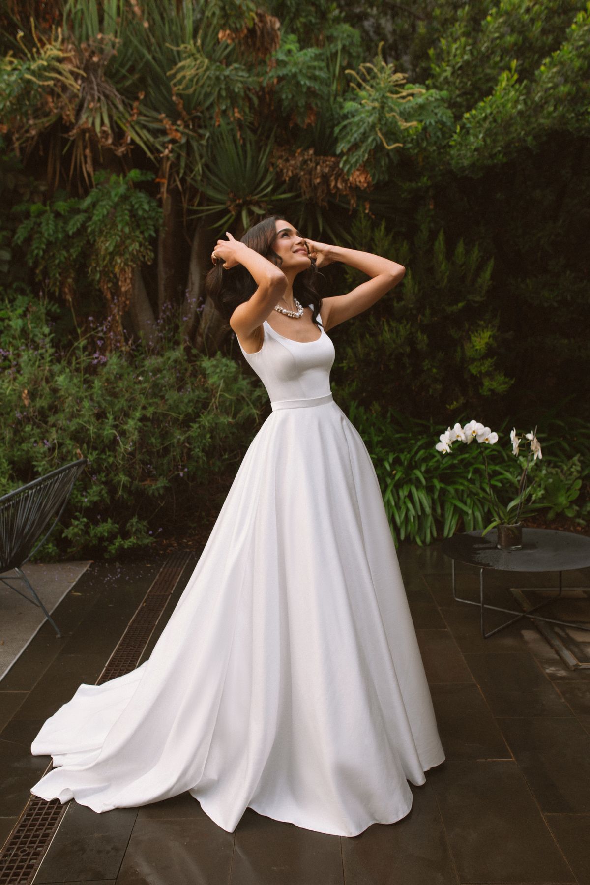 Rara Avis simple satin wedding dress Vela with a long train at Dell'Amore Bridal, NZ 3