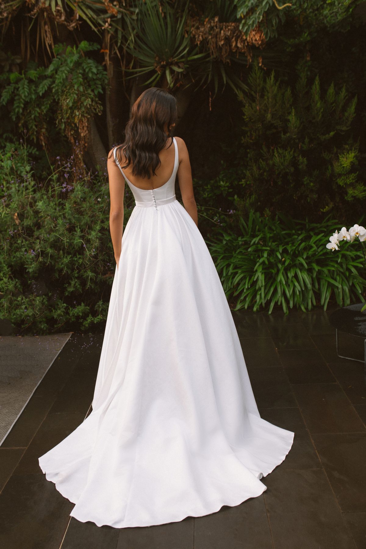 Rara Avis simple satin wedding dress Vela with a long train at Dell'Amore Bridal, NZ 2