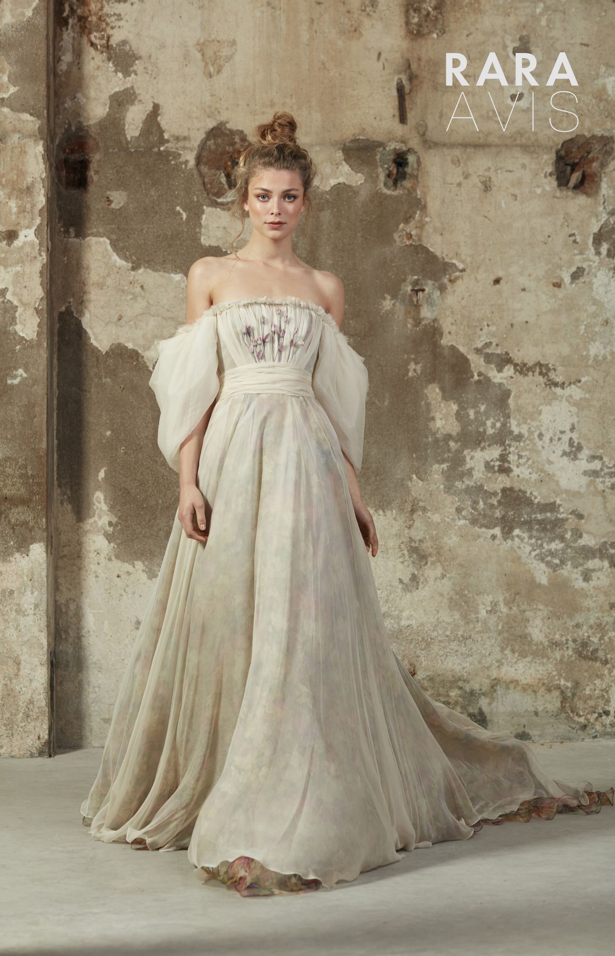 Romantic cream colour wedding gown Hilori by Rara Avis with purple flower decorations and long train.3